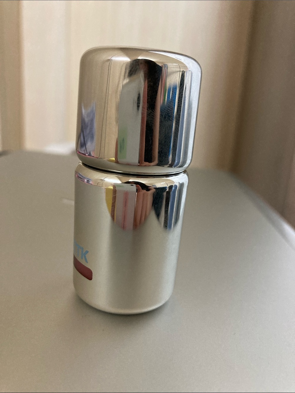 Silver Travel-Size Skin Care Bottle - Compact Moisture Dispenser